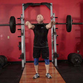 Split Clean step four, man beinging feet together to complete the lift https://get-strong.fit/Fitness